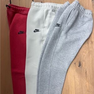 Nike Kids 3-Pack Fleece Joggers in Red, Cream & Gray